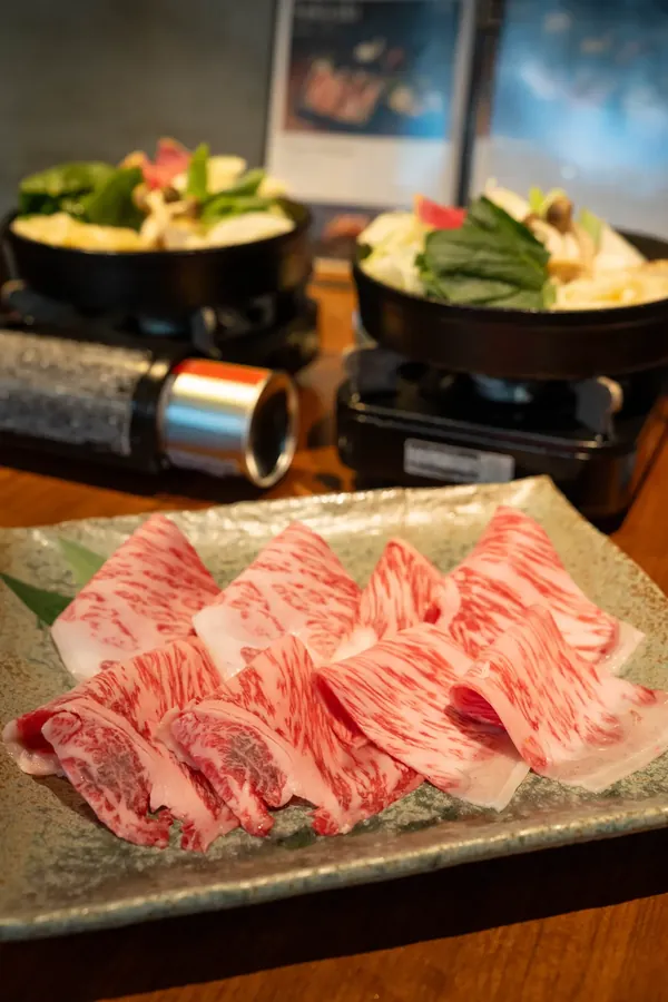A platter of raw Kuroge Wagyu sirloin with fine marbling